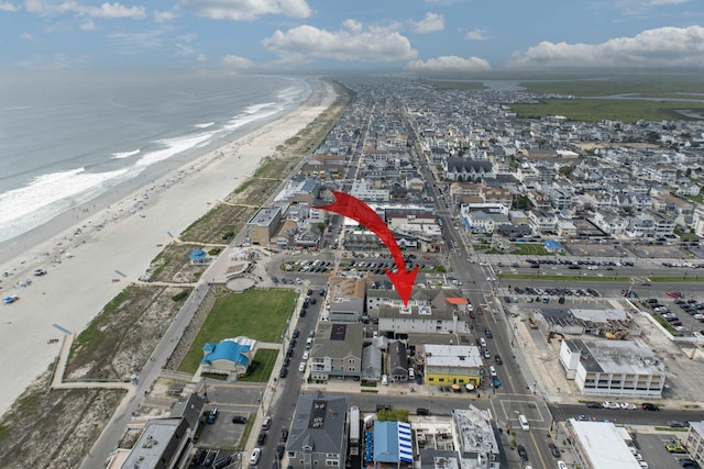 bird's eye view featuring a beach view and a water view