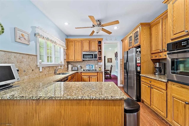 48 Cedar Meadow Dr, Cape May Court House, NJ 08210 - kitchen featuring a sink, appliances with stainless steel finishes, light stone counters, and a ceiling fan