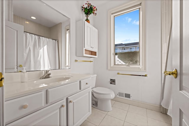 full bath featuring vanity, tile patterned flooring, visible vents, toilet, and baseboards