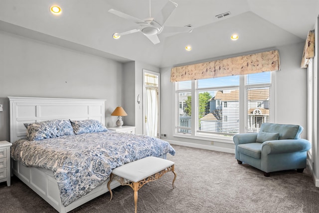bedroom featuring dark carpet, visible vents, and lofted ceiling