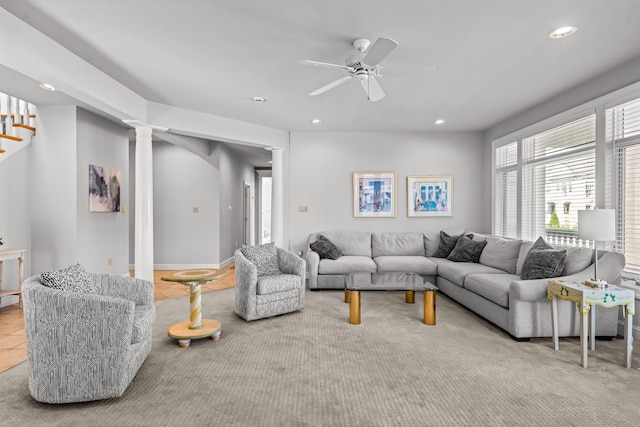 carpeted living room with stairway, a ceiling fan, decorative columns, and recessed lighting