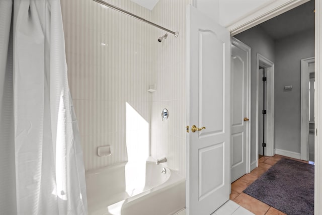 full bath with shower / bath combo and tile patterned floors