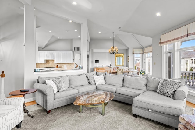 living area featuring visible vents, recessed lighting, a chandelier, and lofted ceiling