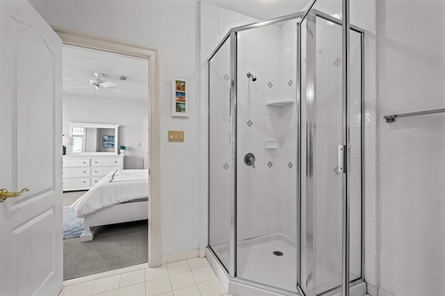 full bath with a shower stall, tile patterned floors, connected bathroom, and ceiling fan