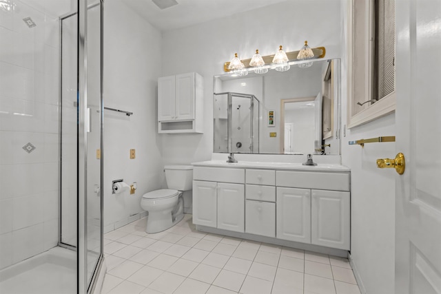 full bathroom featuring double vanity, tile patterned flooring, toilet, a shower stall, and a sink