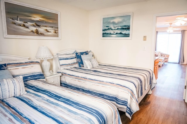 bedroom with wood finished floors