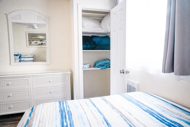 bedroom with a closet and visible vents