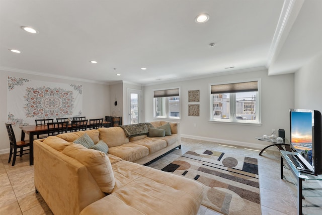 living room with light tile patterned floors and crown molding