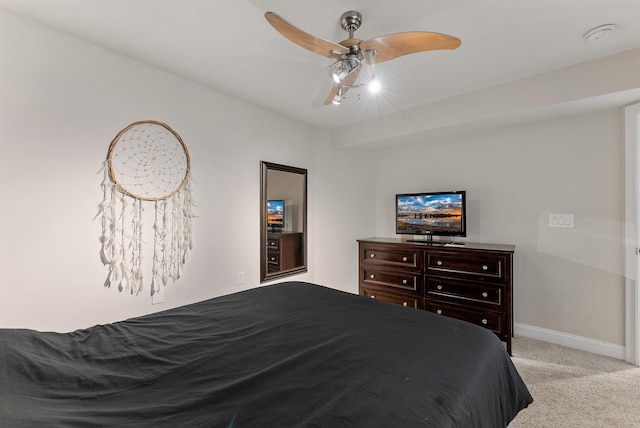 bedroom featuring light colored carpet and ceiling fan