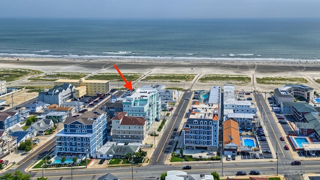 drone / aerial view with a view of the beach and a water view