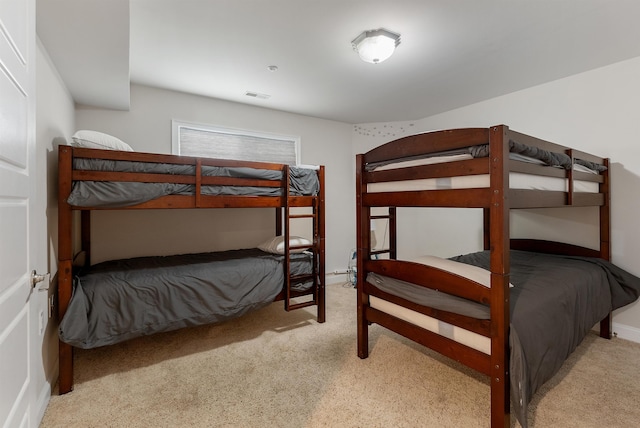 bedroom with light colored carpet