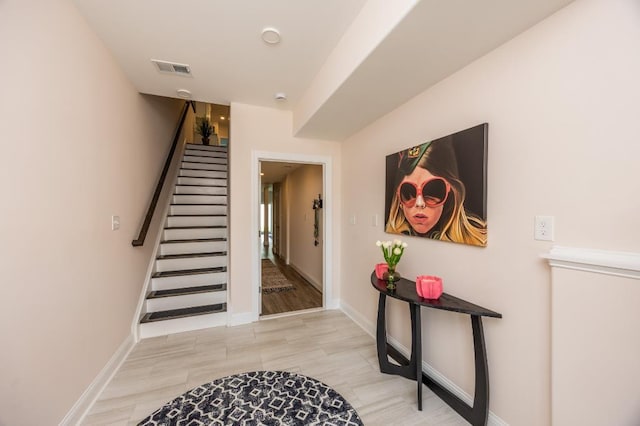 stairs with hardwood / wood-style flooring