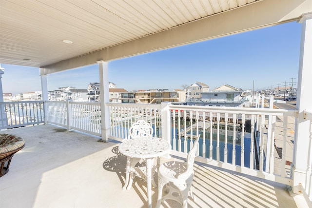 balcony featuring a water view