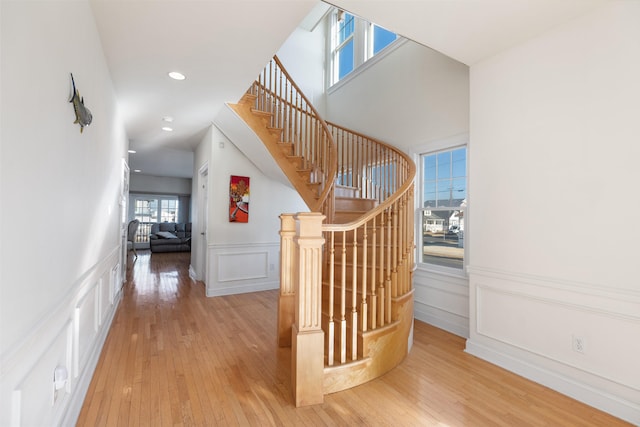 stairs featuring hardwood / wood-style flooring