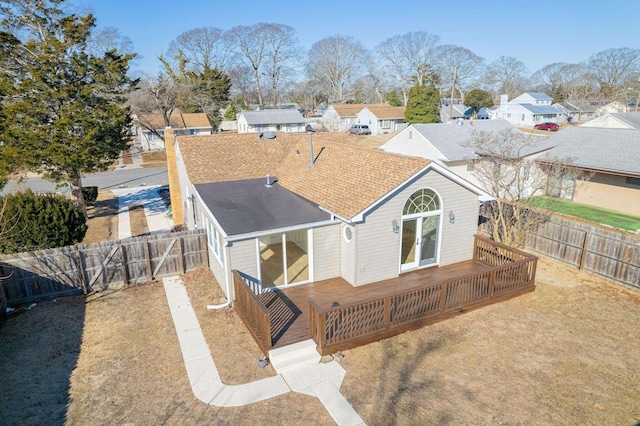 715 Eldredge Ave, North Cape May, NJ 08204 - back of property featuring a shingled roof, a residential view, a fenced backyard, and a wooden deck