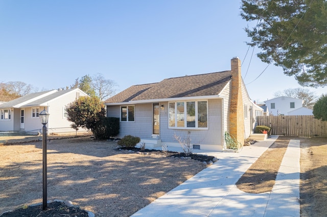 715 Eldredge Ave, North Cape May, NJ 08204 - bungalow-style home with fence, a chimney, and roof with shingles