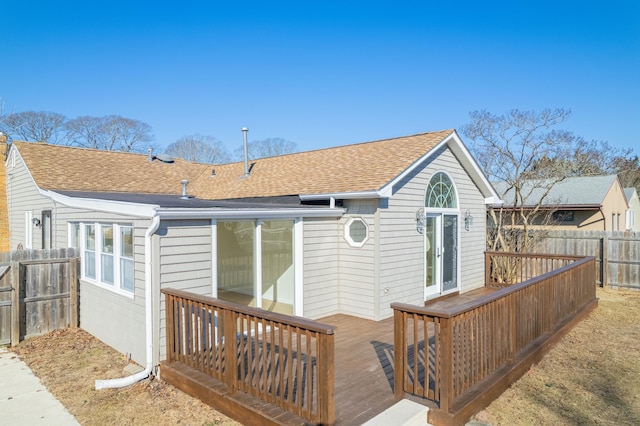 715 Eldredge Ave, North Cape May, NJ 08204 - rear view of house featuring a shingled roof, fence, and a deck