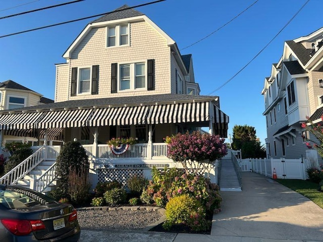 127 34th St, Avalon, NJ 08202 - view of front facade with a porch