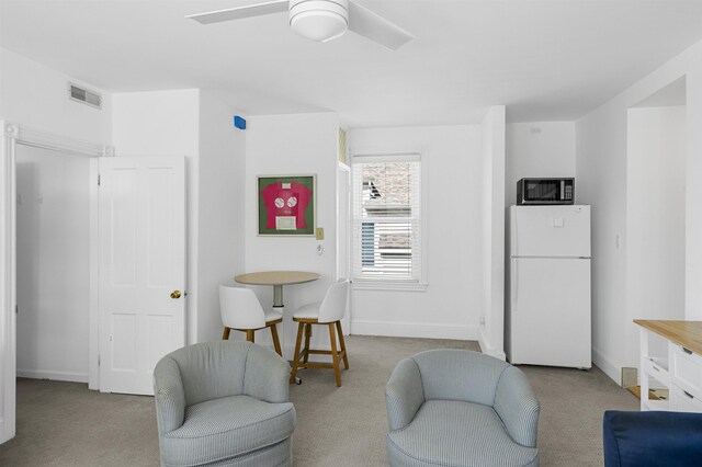 127 34th St, Avalon, NJ 08202 - sitting room with carpet flooring, ceiling fan, and baseboards