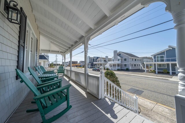 127 34th St, Avalon, NJ 08202 - wooden porch featuring a residential view