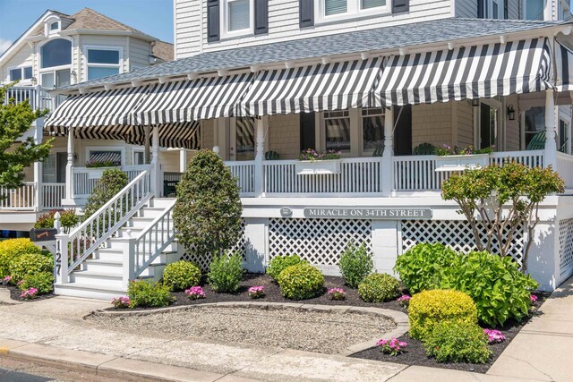 127 34th St, Avalon, NJ 08202 - exterior space featuring roof with shingles and a porch