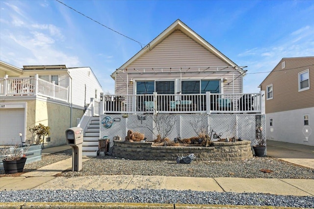 view of front of house with stairs