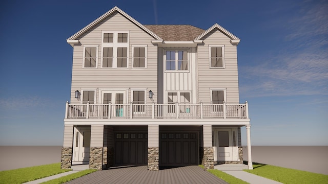 view of front of house with a balcony and a garage