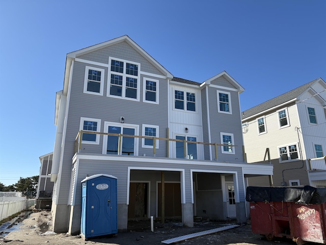 rear view of property with a balcony