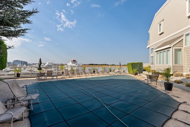 view of swimming pool featuring a patio