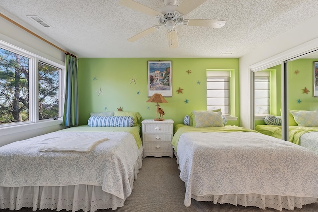 41 Marine Way Unit 41, Avalon, NJ 08202 - carpeted bedroom featuring a textured ceiling, ceiling fan, and a closet