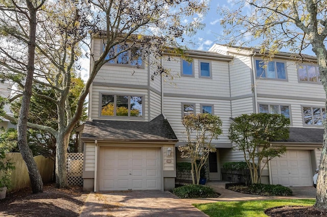 townhome / multi-family property featuring a garage