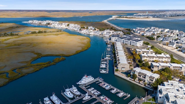 bird's eye view featuring a water view and a view of the beach