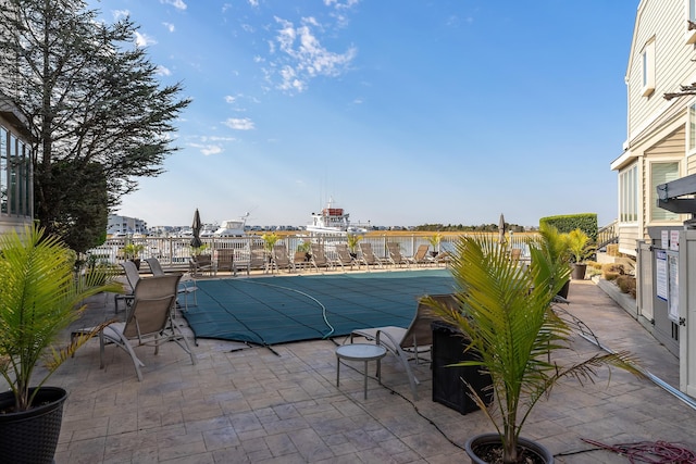 view of swimming pool featuring a patio