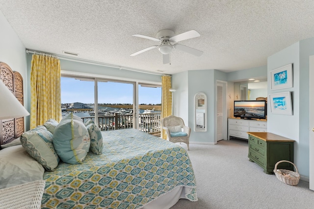41 Marine Way Unit 41, Avalon, NJ 08202 - carpeted bedroom featuring access to exterior, a ceiling fan, and a textured ceiling