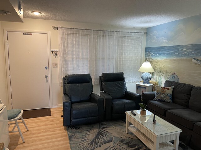 875 Plymouth Pl Unit 33, Ocean City, NJ 08226 - living room featuring a textured ceiling and light wood-style flooring