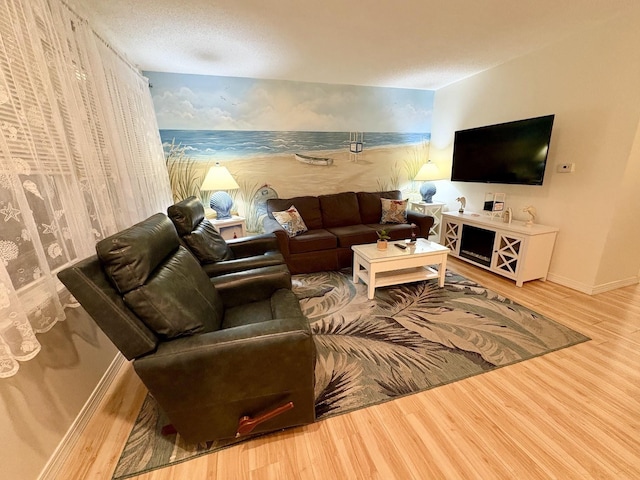 875 Plymouth Pl Unit 33, Ocean City, NJ 08226 - living room with wallpapered walls, wood finished floors, and baseboards