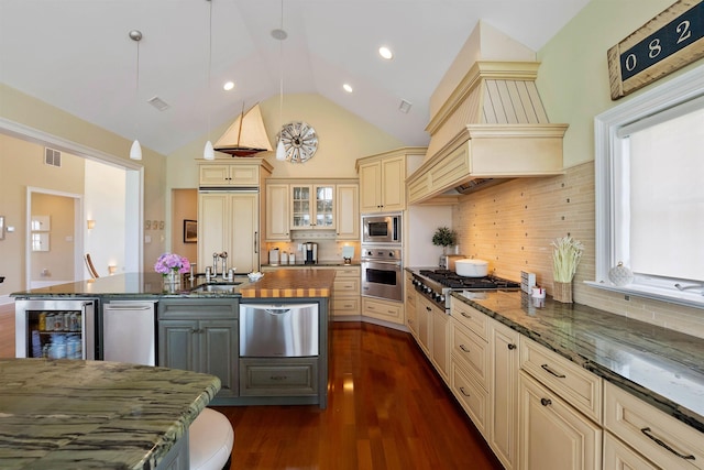 9 Seabreeze Ln, Avalon Manor, NJ 08202 - kitchen featuring cream cabinets, built in appliances, beverage cooler, dark stone counters, and dark wood-type flooring