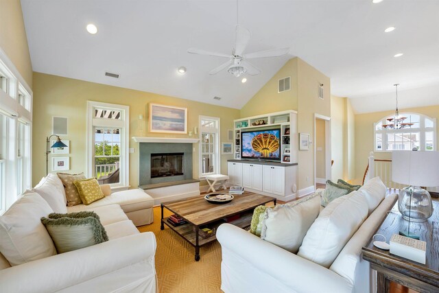 9 Seabreeze Ln, Avalon Manor, NJ 08202 - living area with lofted ceiling, a ceiling fan, a chandelier, recessed lighting, and a glass covered fireplace