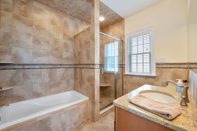 9 Seabreeze Ln, Avalon Manor, NJ 08202 - bathroom featuring tile walls, a stall shower, tiled bath, and vanity