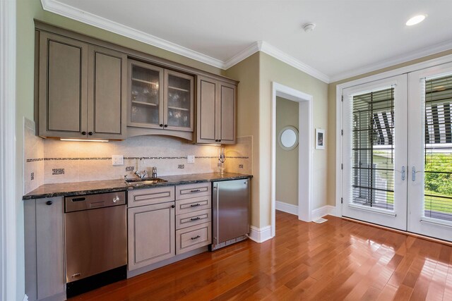 9 Seabreeze Ln, Avalon Manor, NJ 08202 - bar area featuring stainless steel dishwasher, refrigerator, french doors, decorative backsplash, and ornamental molding