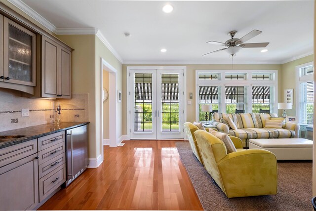 9 Seabreeze Ln, Avalon Manor, NJ 08202 - living room with french doors, crown molding, recessed lighting, ceiling fan, and light wood-style floors