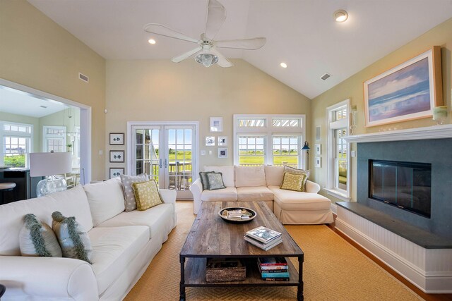 9 Seabreeze Ln, Avalon Manor, NJ 08202 - living room with high vaulted ceiling, a glass covered fireplace, a ceiling fan, and recessed lighting