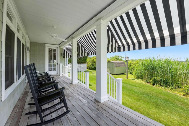 9 Seabreeze Ln, Avalon Manor, NJ 08202 - deck featuring a lawn, a storage unit, and a ceiling fan