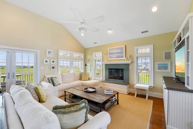 9 Seabreeze Ln, Avalon Manor, NJ 08202 - living room with dark wood-style flooring, ceiling fan, high vaulted ceiling, healthy amount of natural light, and a glass covered fireplace