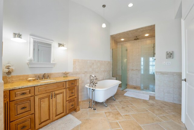 9 Seabreeze Ln, Avalon Manor, NJ 08202 - bathroom featuring tile walls, a shower stall, a freestanding tub, vanity, and a wainscoted wall