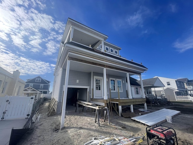 view of front of house featuring covered porch and a garage