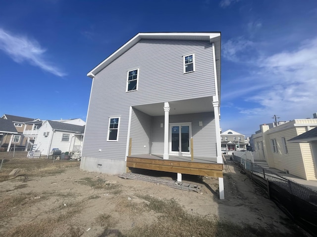 rear view of house with a wooden deck