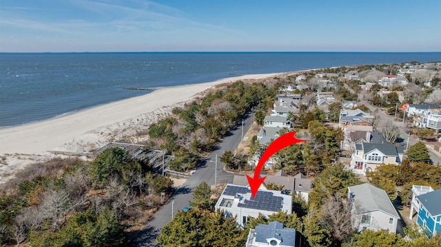 aerial view with a beach view, a residential view, and a water view