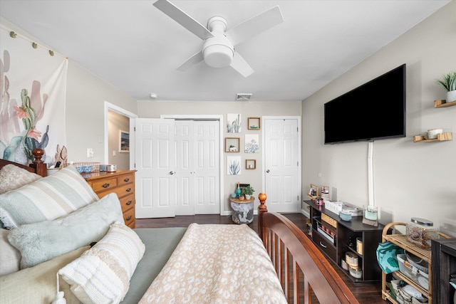 bedroom featuring dark hardwood / wood-style flooring and ceiling fan