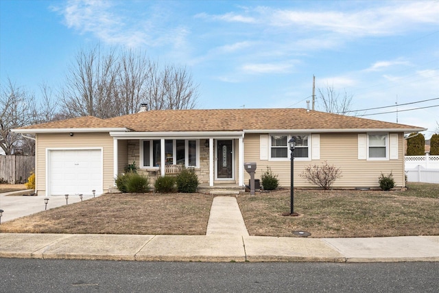 ranch-style house featuring a garage and a front yard